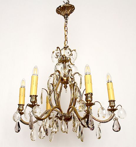 BRASS AND CRYSTAL SIX ARM CHANDELIERA
