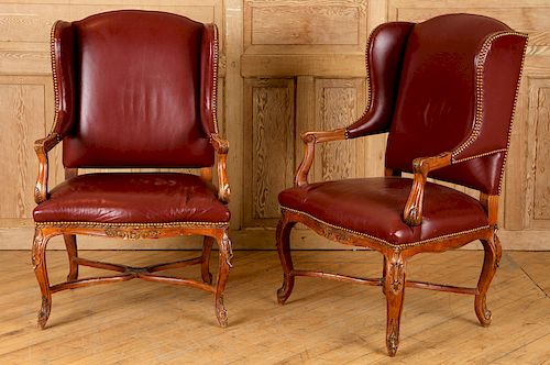 PAIR CARVED LEATHER WING CHAIRS