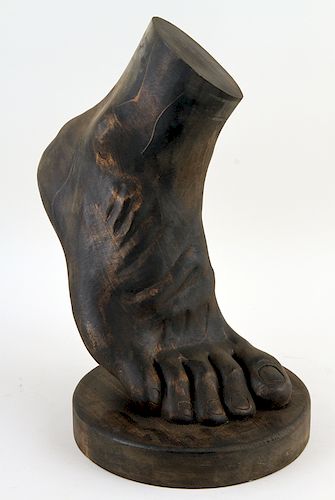 CARVED WOOD SCULPTURE OF A FOOTA carved