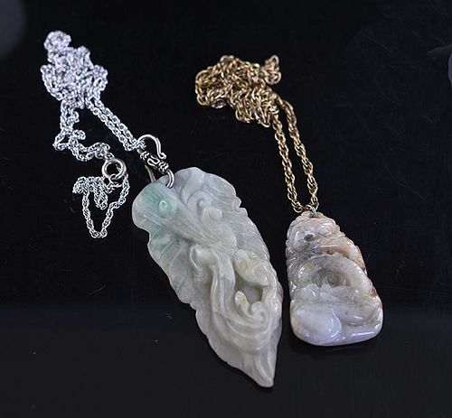 TWO CARVED CHINESE JADE PENDANTS 38a392