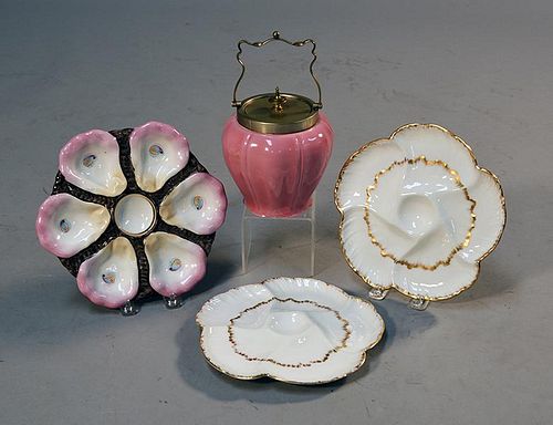 THREE OYSTER PLATES AND A PINK