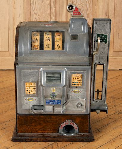 A FIVE CENT ROCK-OLA SLOT MACHINE CIRCA