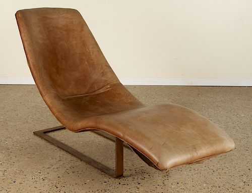 A LEATHER AND IRON CHAISE LOUNGE