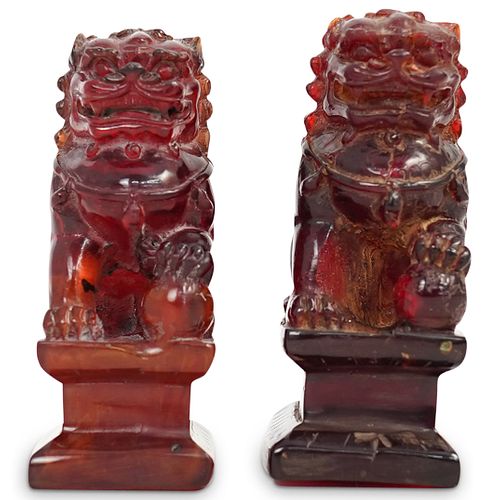 CHINESE CARVED AMBER FOO DOGSDESCRIPTION: