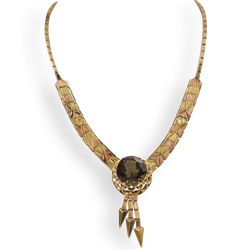 14K GOLD AND TOPAZ MECHANICAL NECKLACEDESCRIPTION: