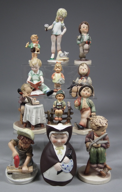A collection of Hummel pottery figures