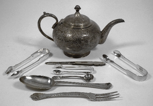 An Indian silvery metal bulbous teapot