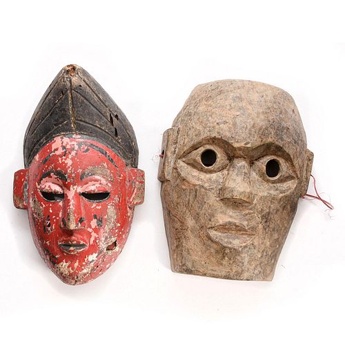 TWO ASIAN HAND CARVED WOODEN MASKSTwo