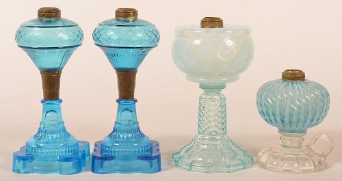 FOUR VARIOUS GLASS FLUID LAMPS.Four