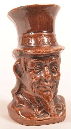 BROWN GLAZED EARTHENWARE UNCLE SAM STILL