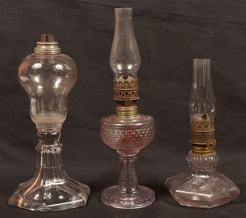 THREE VARIOUS ANTIQUE FLUID LAMPS.Three