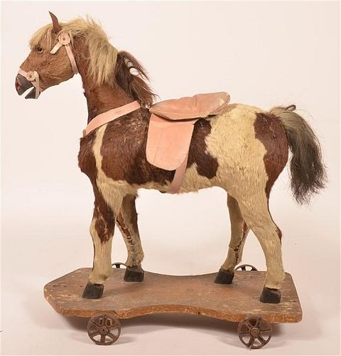 ANTIQUE HYDE COVERED HORSE RIDING
