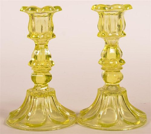 PAIR OF VASELINE FLINT GLASS CANDLESTICKS.Pair