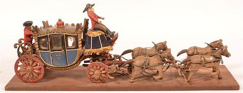 CARVED AND PAINTED WOOD FOLK ART COACH.Early