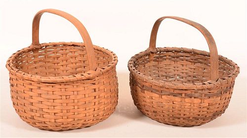 TWO CIRCULAR FORM MARKET BASKETS.Two