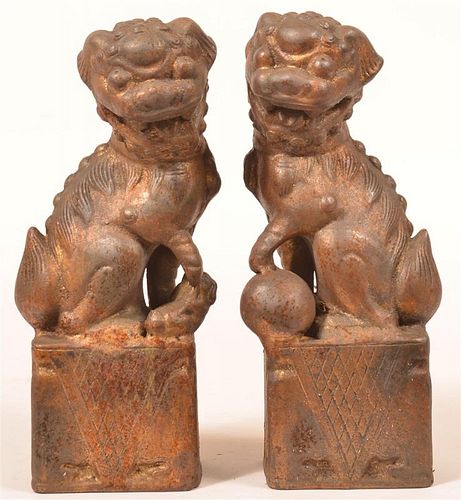 PAIR OF ORIENTAL CAST METAL FOO