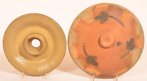 TWO VARIOUS STONEWARE POTTERY LIDS.Two