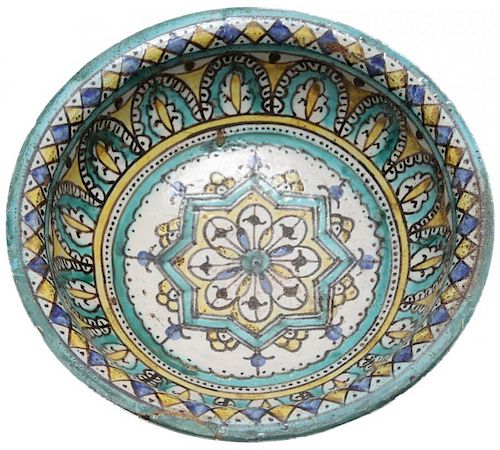 A MOROCCAN TIN GLAZED EARTHENWARE