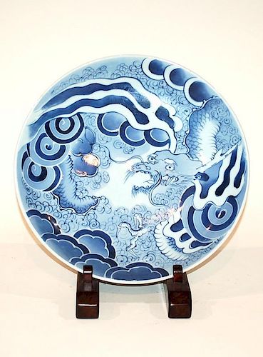 A JAPANESE BLUE AND GLAZE DRAGON PLATTER13.25