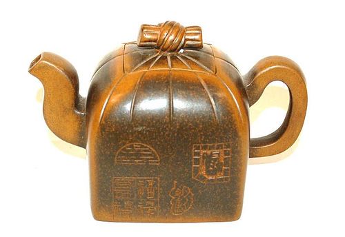 A JAPANESE TERRA COTTA TEAPOT WITH
