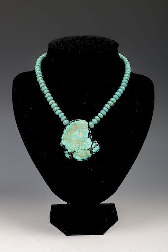 TURQUOISE NECKLACEComprising a strand