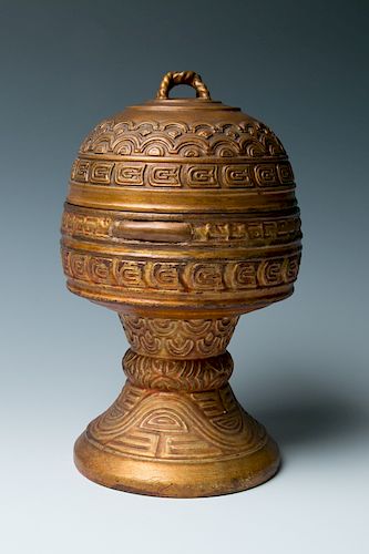 A GILT WOOD RITUAL CONTAINER AND