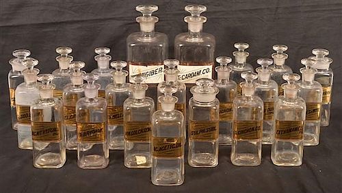 TWENTY-TWO APOTHECARY GLASS BOTTLES.Twenty