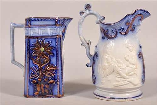 TWO VARIOUS FLOW BLUE CHINA PITCHERS Two 39b9ed
