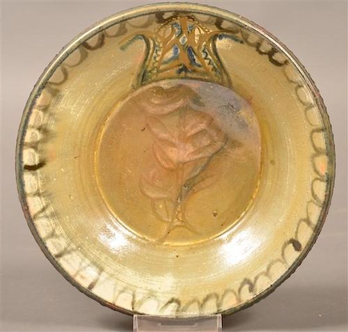 STAHL REDWARE BOWL WITH TULIP DECORATION.Stahl