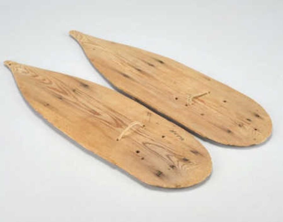 BOG SHOESA pair of wooden plank mud
