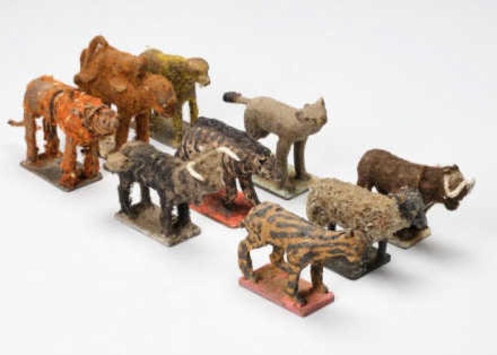 FORGED TOY ANIMALSA grouping of