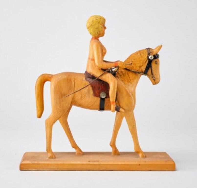 EQUESTRIAN CARVINGA sculpture of a lady