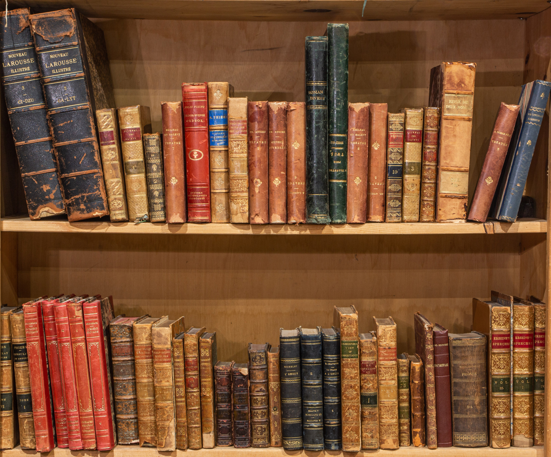 TWO SHELVES OF LEATHER BOUND BOOKS