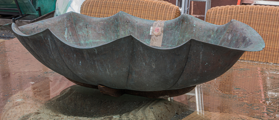A PATINATED BRONZE SCALLOP FORM