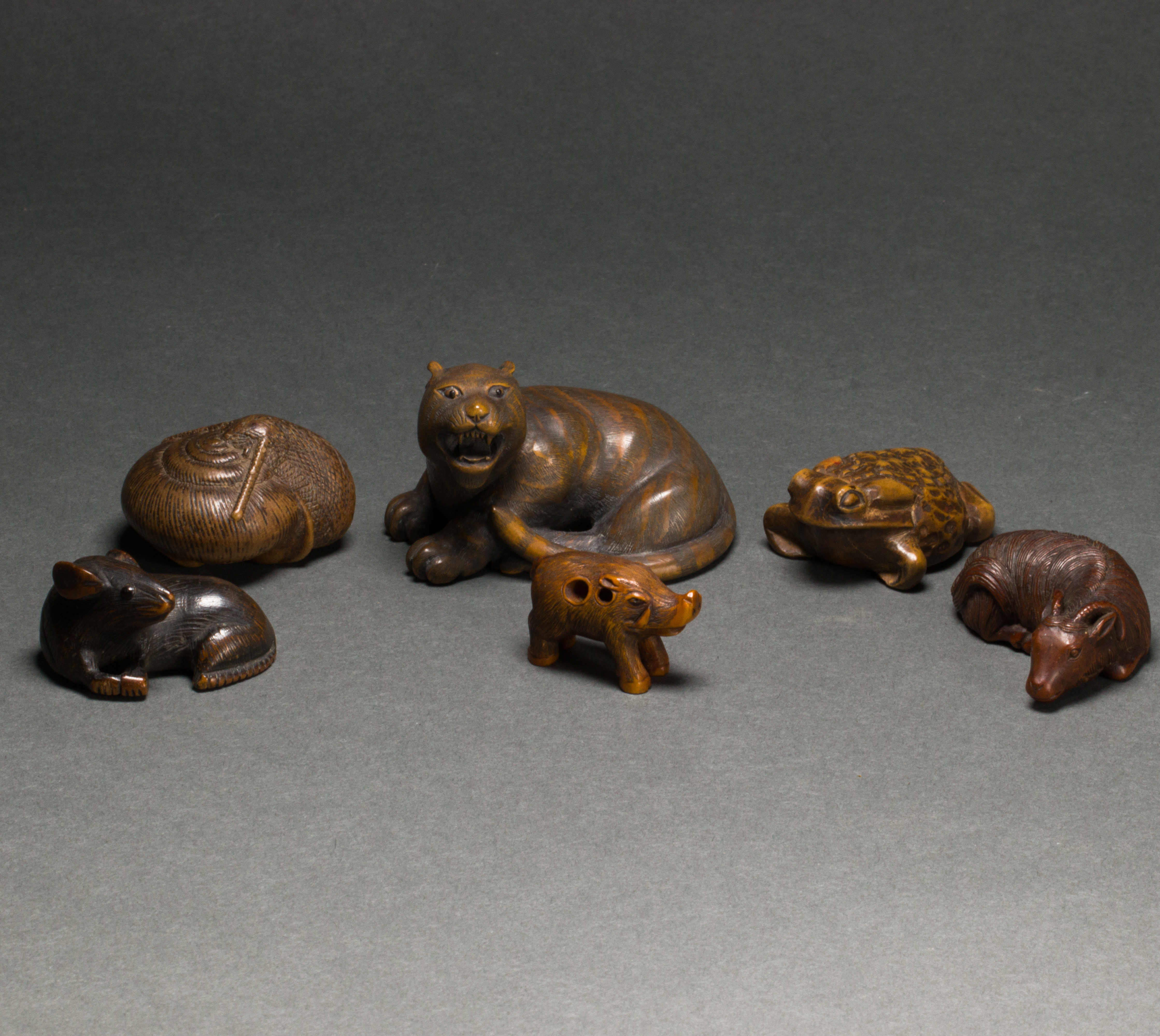 SIX JAPANESE WOOD ANIMAL NETSUKE