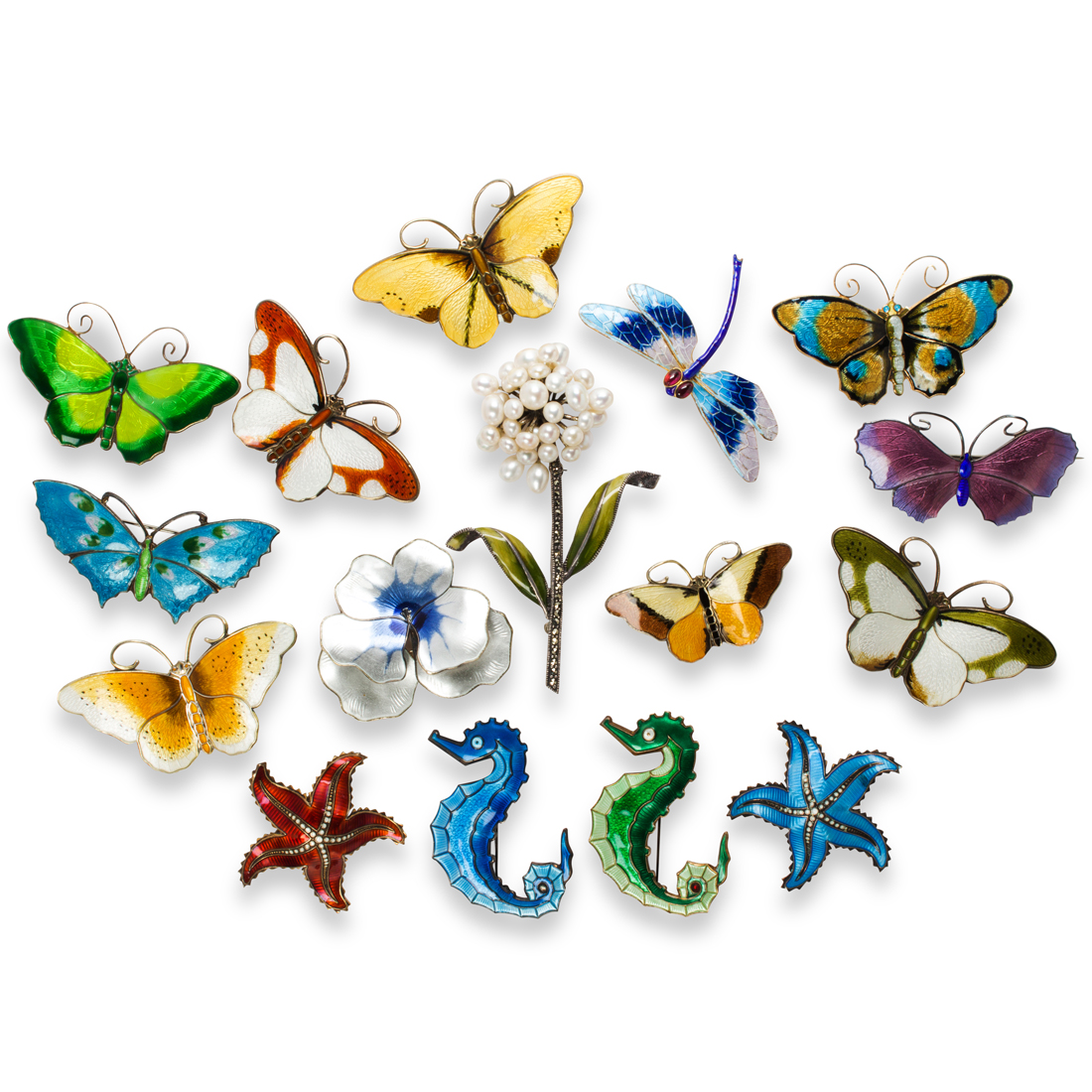 A GROUP OF ENAMEL AND SILVER BROOCHES