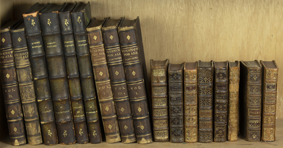 A SHELF OF ANTIQUE MOSTLY LEATHER 3a216b