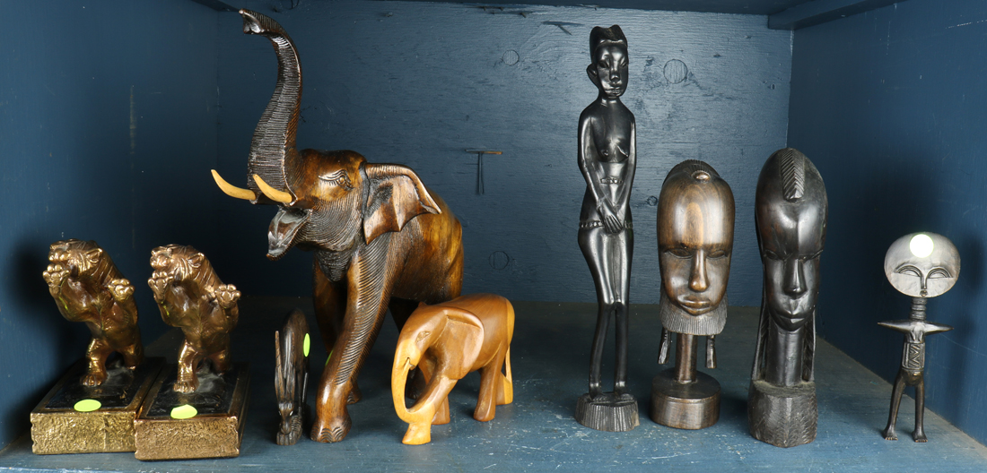 SHELF OF MOSTLY AFRICAN CARVED