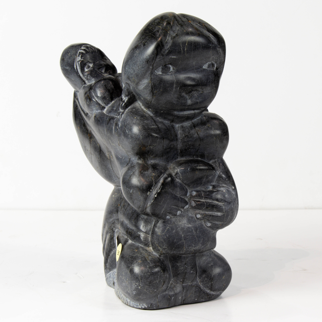 AN ESKIMO SCULPTURE OF MOTHER AND 3a21d2