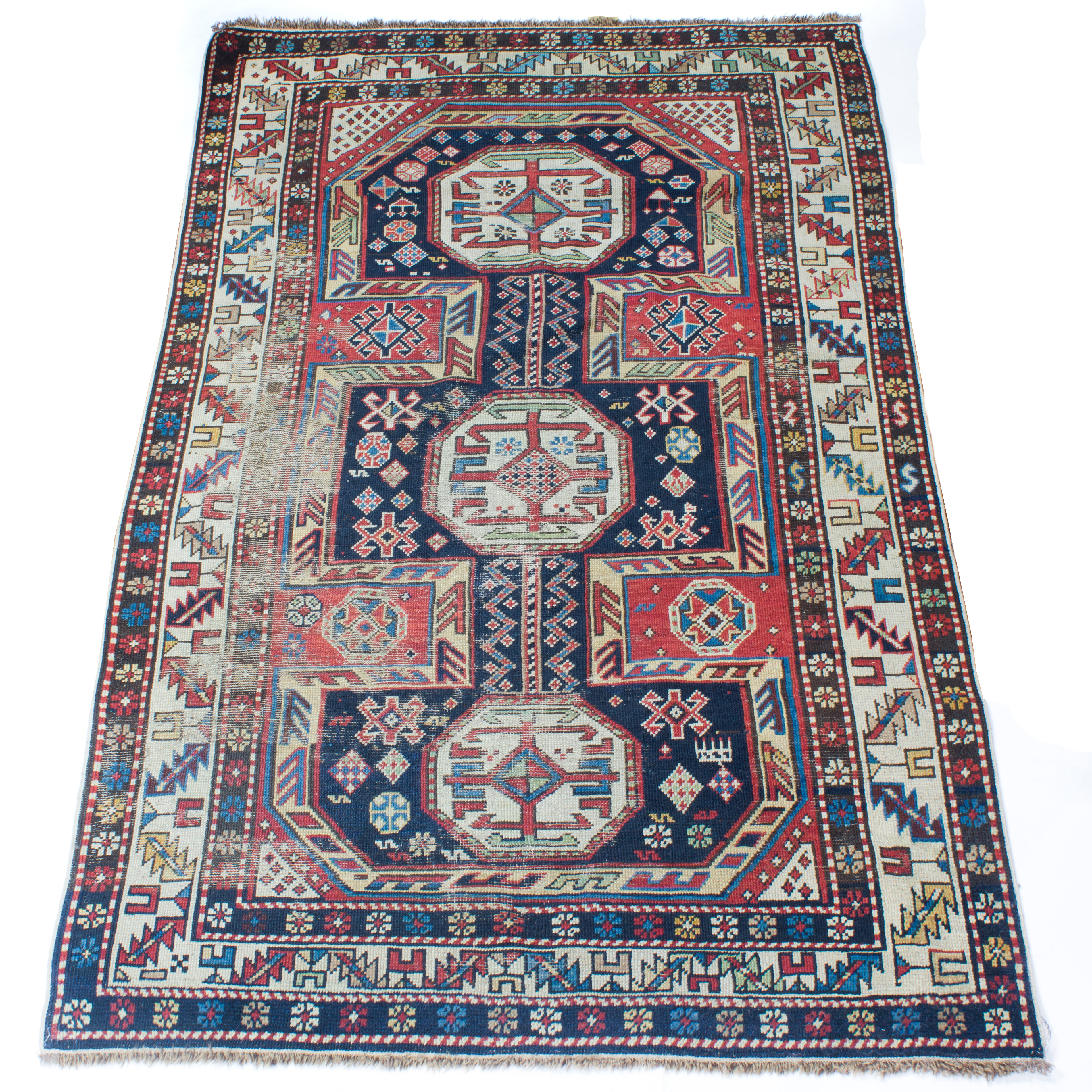 A CAUCASIAN CARPET A Caucasian carpet,