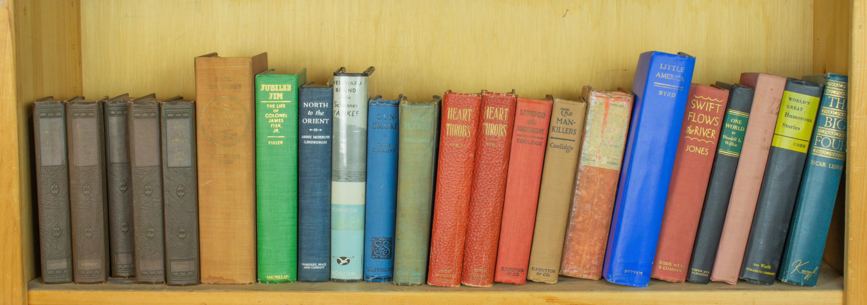 SHELF OF BOOKS INCLUDING A SCRIBNER