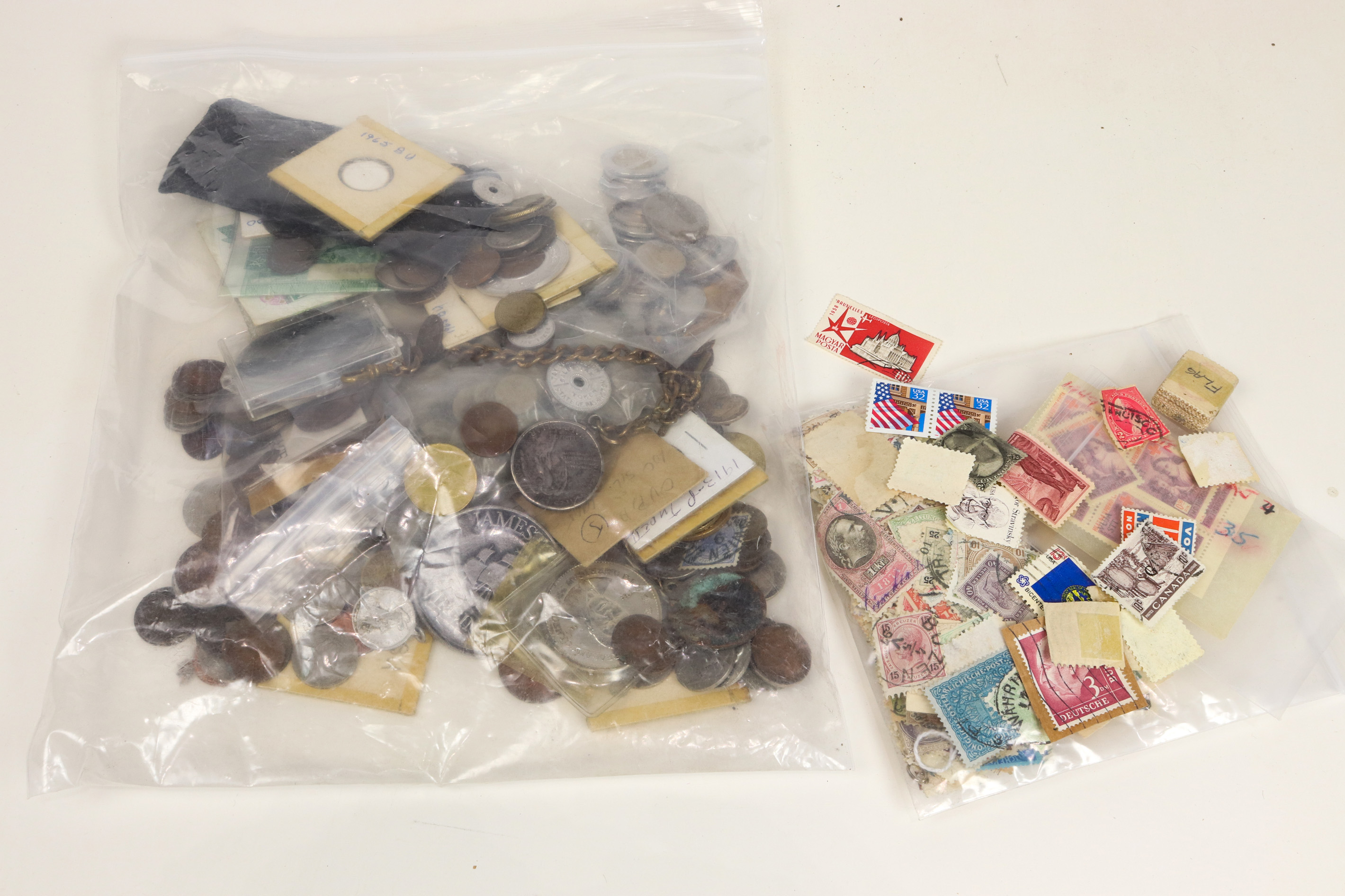 ONE BAG OF ASSORTED COINS AND STAMPS 3a36d3