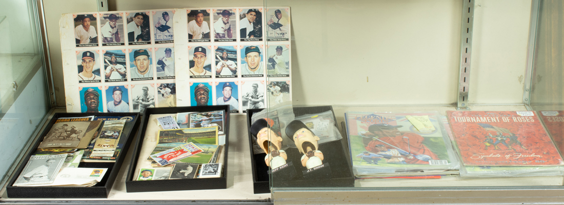 ONE SHELF OF SPORTS MEMORABILIA