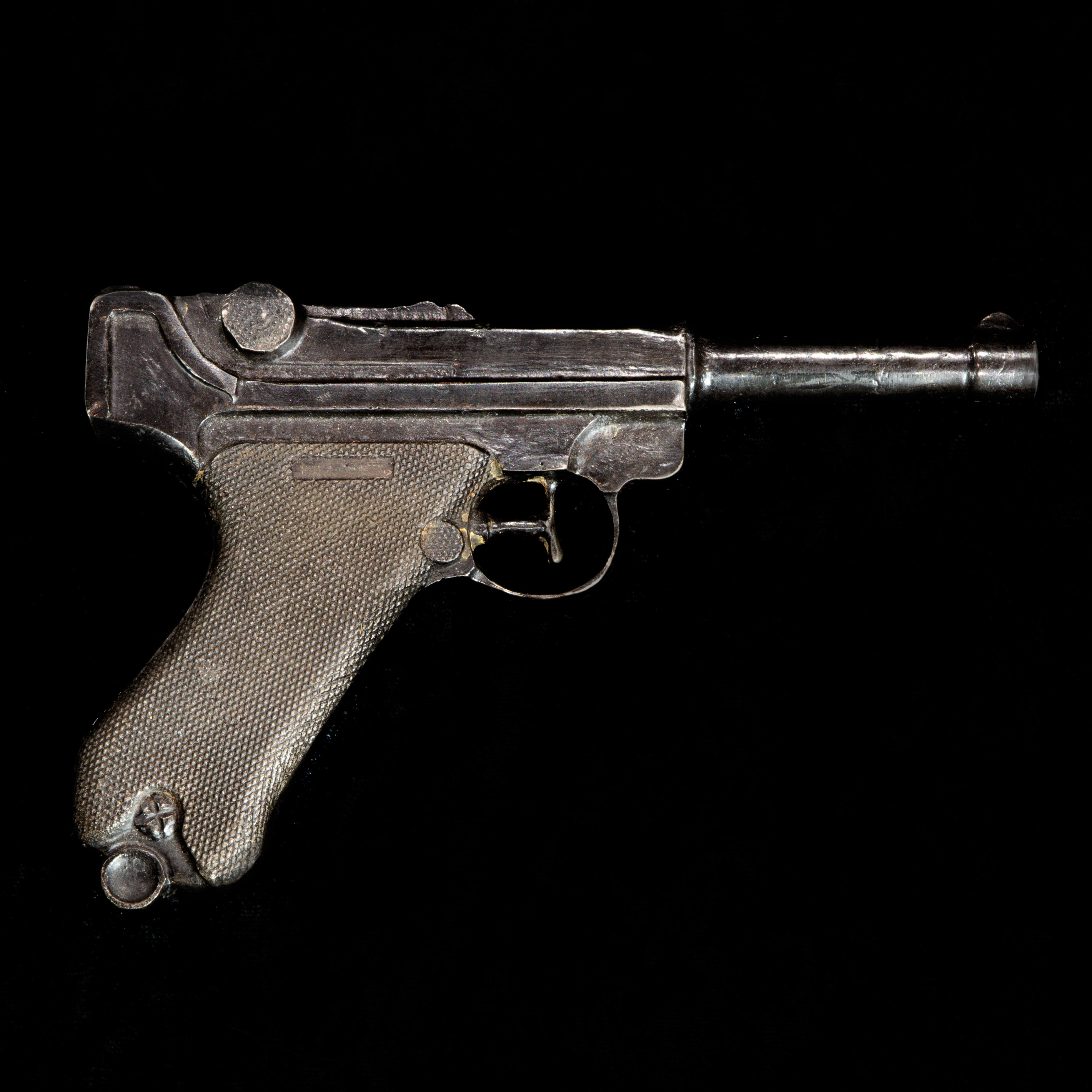 A BRONZE SCULPTURE OF A REVOLVER  3a3cf4