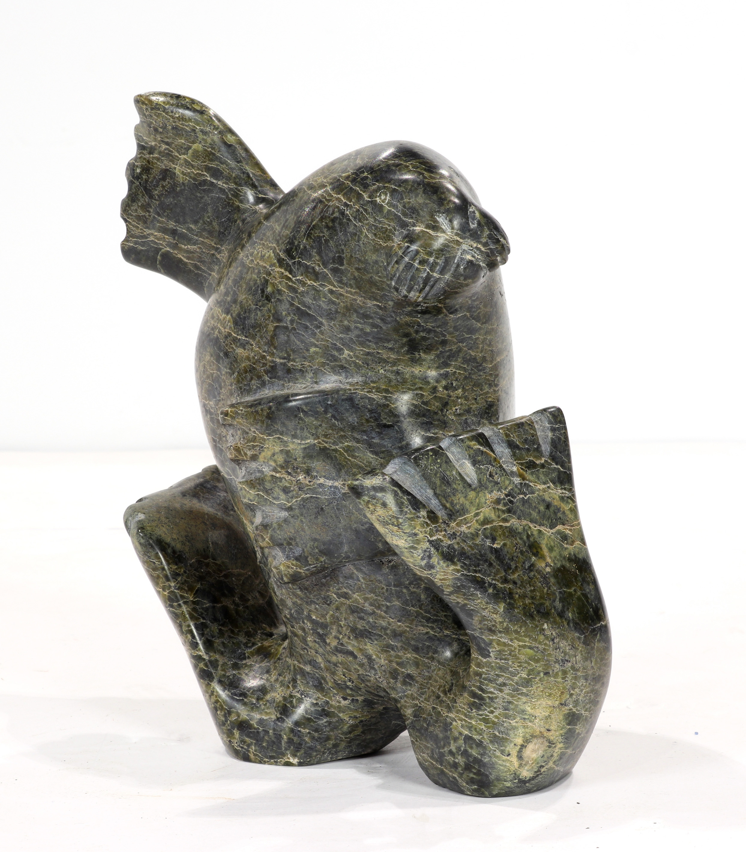 AN ADAMEE INUIT STONE CARVING OF
