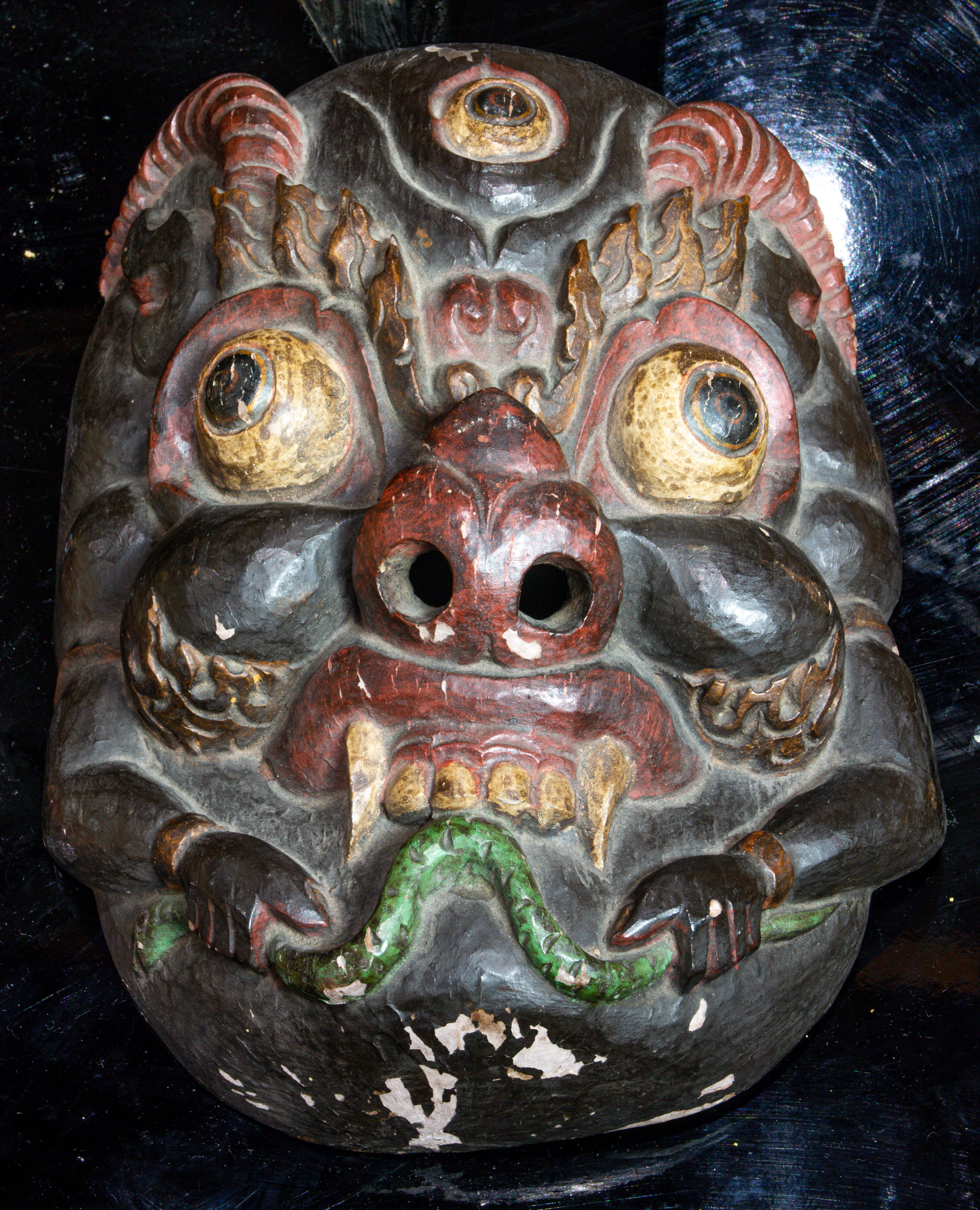 ELABORATELY CARVED AND PAINTED MASK