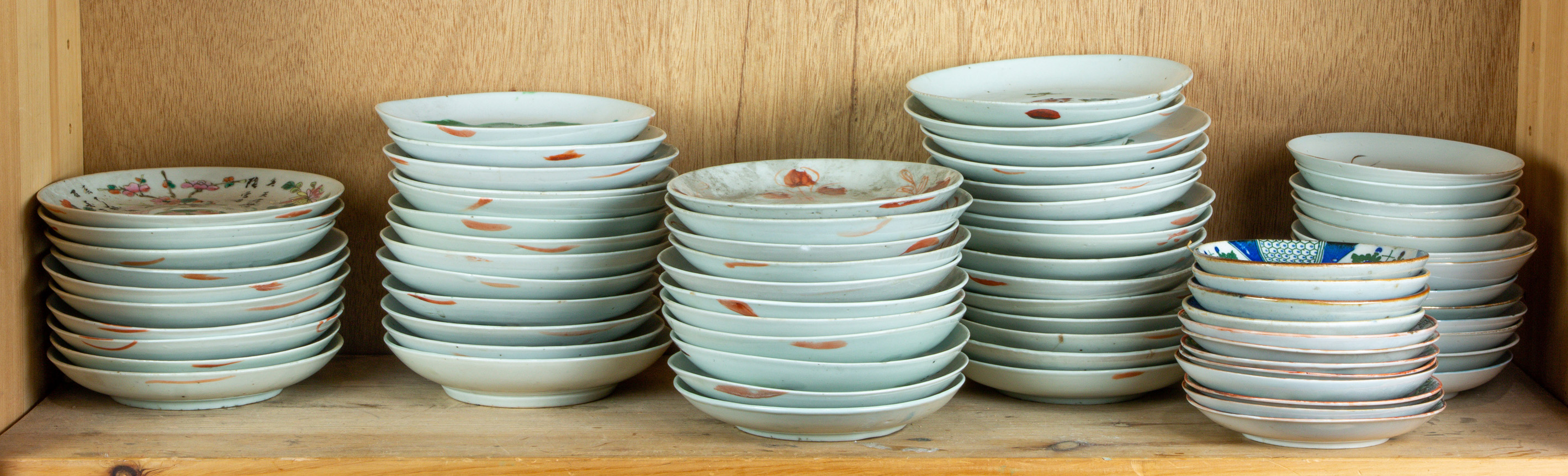 SHELF OF CHINESE ENAMELED DISHES