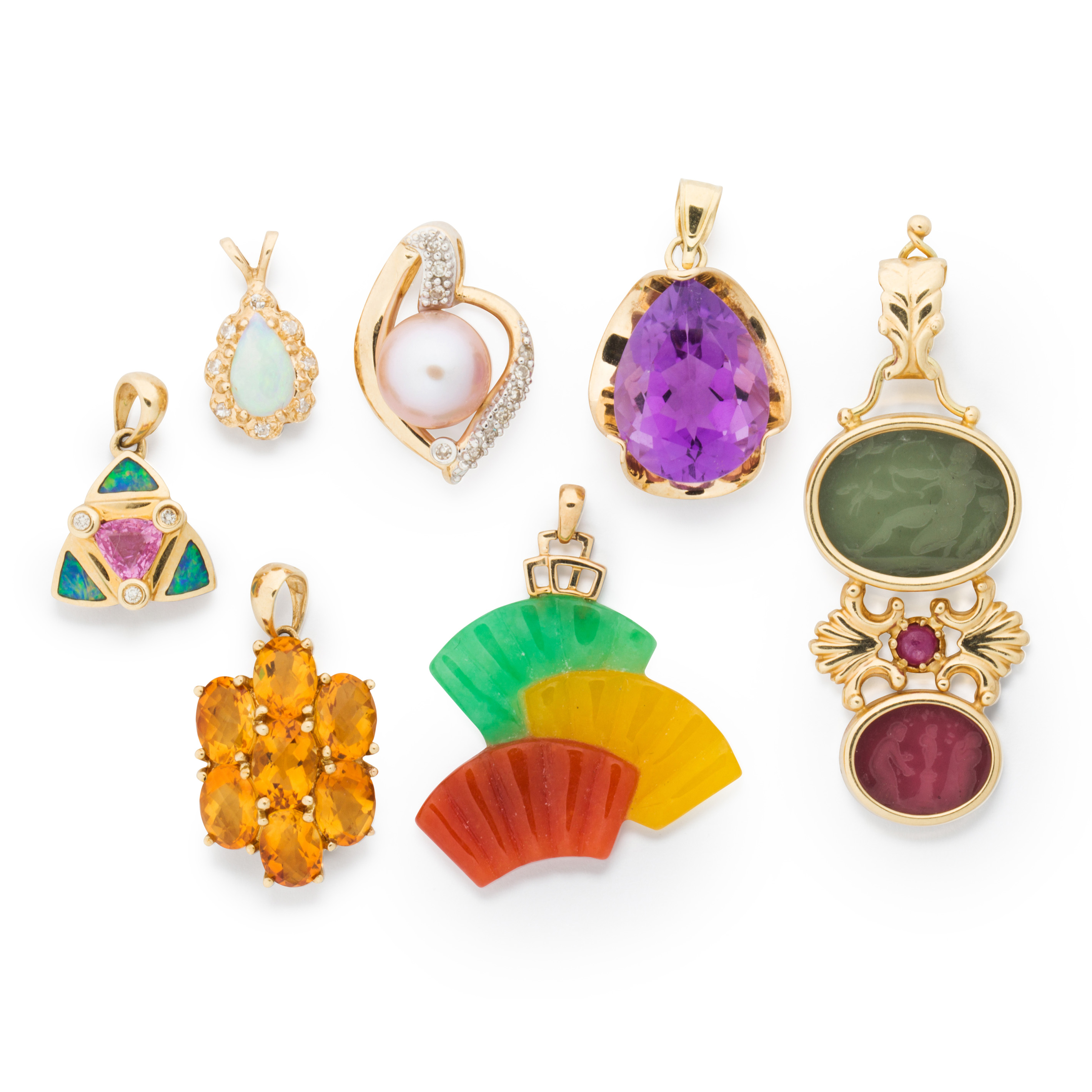 A GROUP OF GEMSTONE AND GOLD PENDANTS
