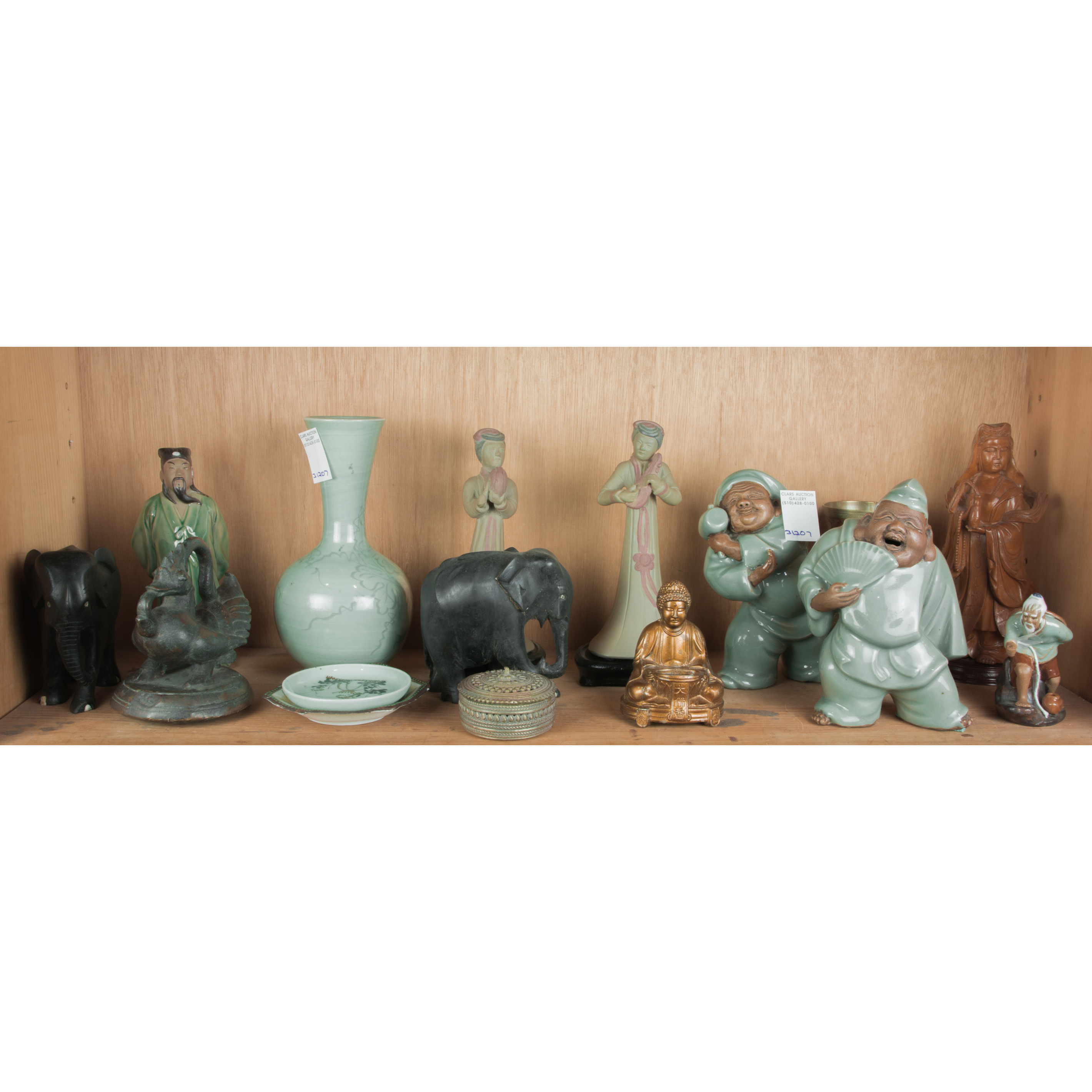 SHELF OF ASIAN DECORATIVE ITEMS 3a4537