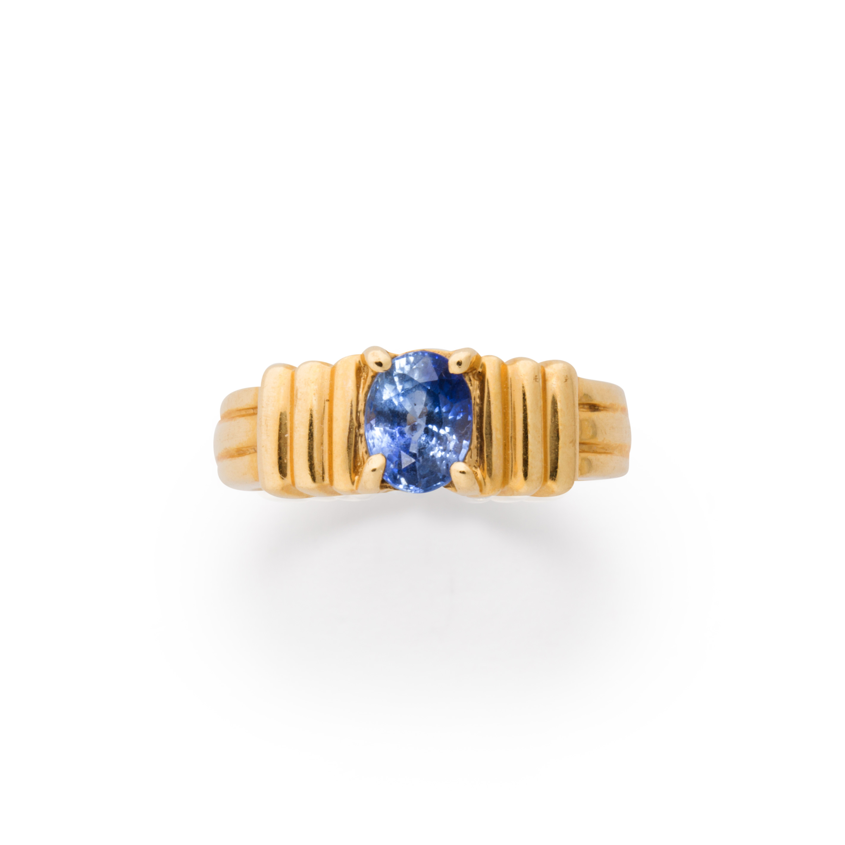 A SAPPHIRE AND FOURTEEN KARAT GOLD